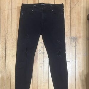 Women’s Black Skinny Jeans with Distressed Details